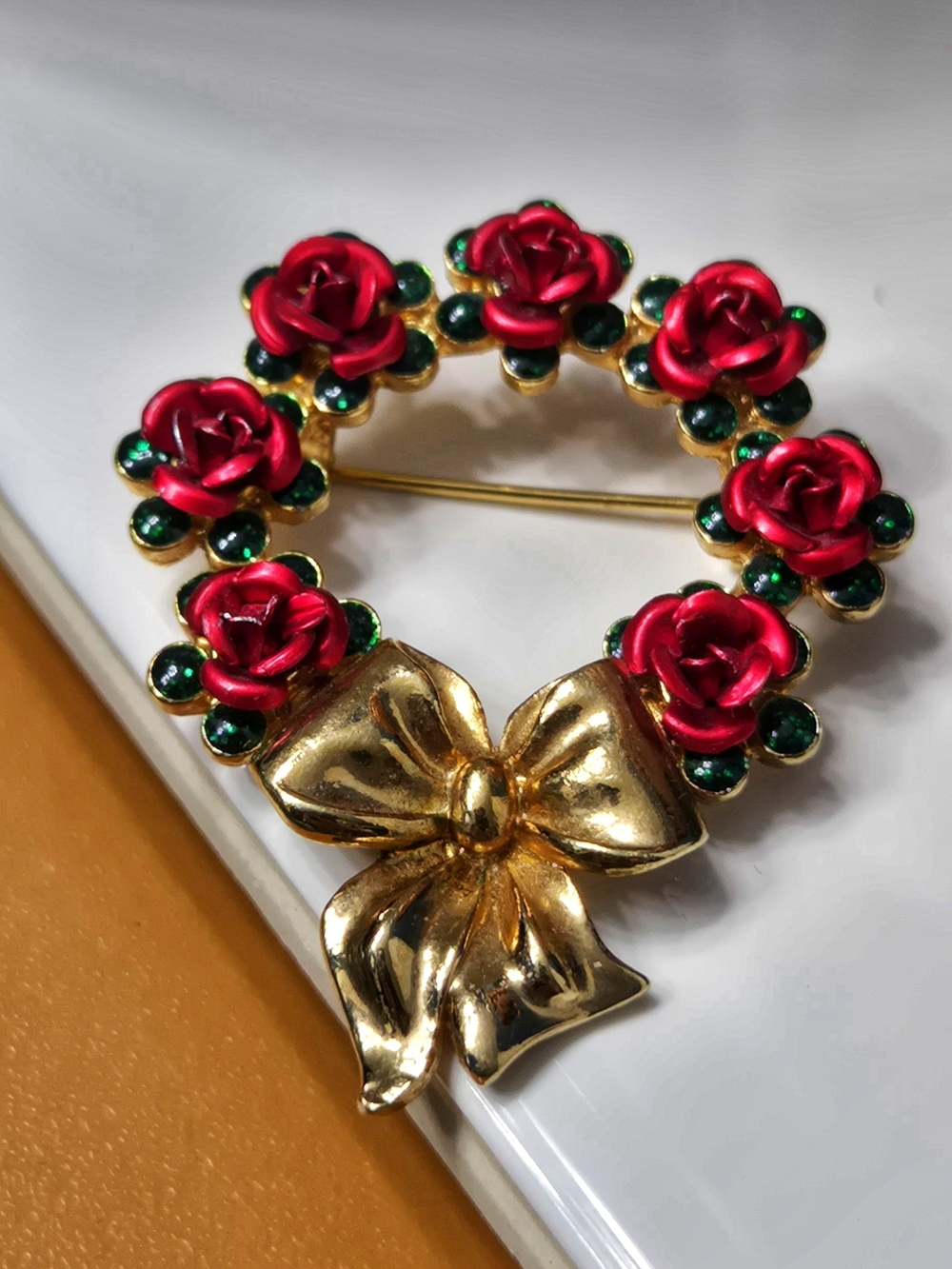 Avon Gold Bow Wreath Brooch with Red Roses and Green Accents